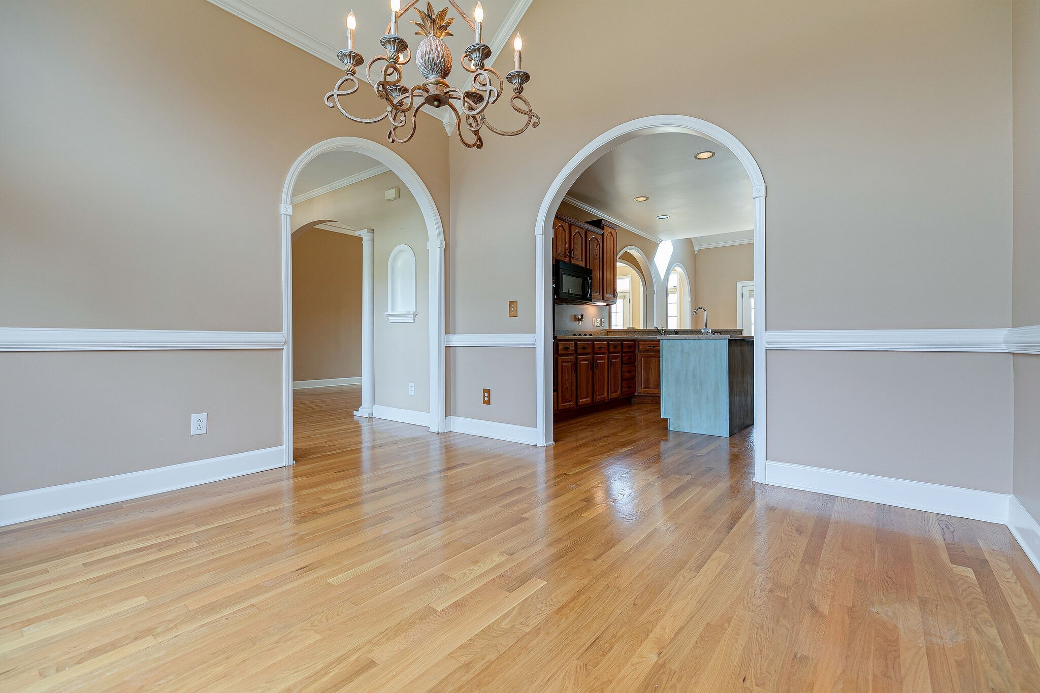 Undisclosed Address Franklin, TN 37064 - Photo 8 of 67 a view of a room with wooden floor and chandelier