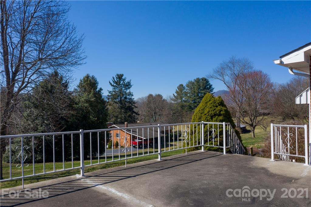 85 Walnut Ford Road Clyde, NC 28721 - Photo 2 of 24 a view of street with a wooden fence