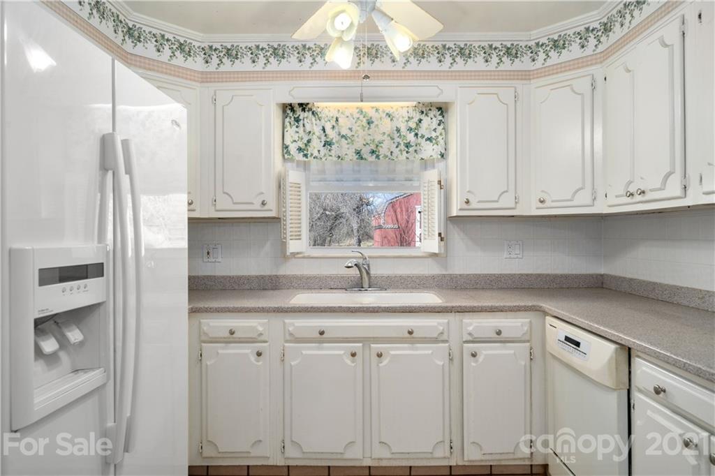 85 Walnut Ford Road Clyde, NC 28721 - Photo 14 of 24 a kitchen with appliances cabinets and a sink