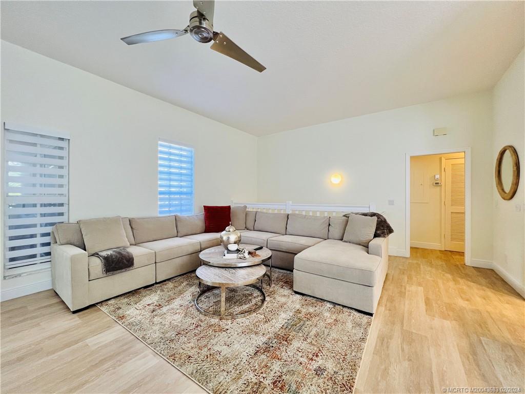 411 Northeast Plantation Road, Unit 526 Stuart, FL 34996 - Photo 22 of 76 a living room with furniture and a couch