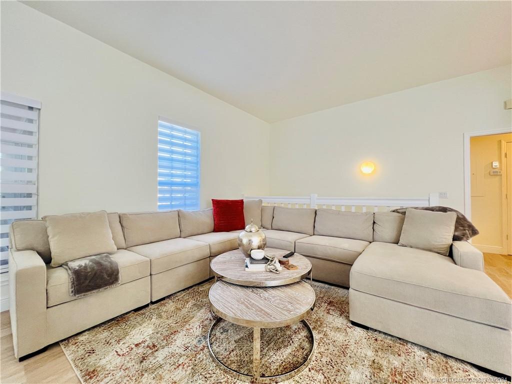411 Northeast Plantation Road, Unit 526 Stuart, FL 34996 - Photo 23 of 76 a living room with furniture and a dining table