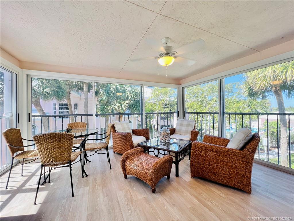 411 Northeast Plantation Road, Unit 526 Stuart, FL 34996 - Photo 30 of 76 a living room with furniture and a wooden floor