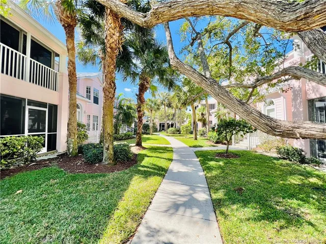 a view of a livingroom with furniture and a flat screen tv