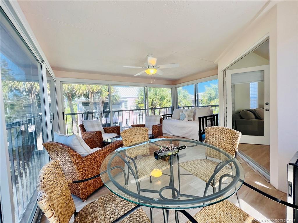 411 Northeast Plantation Road, Unit 526 Stuart, FL 34996 - Photo 32 of 76 a living room with furniture and a large window