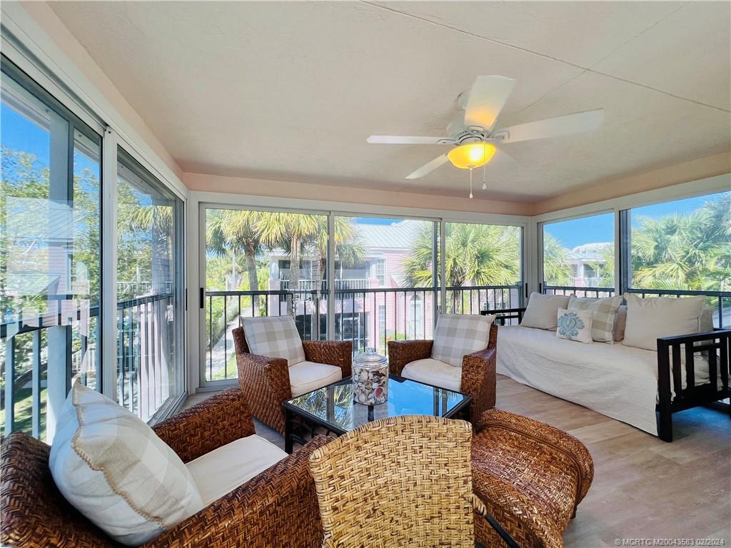 411 Northeast Plantation Road, Unit 526 Stuart, FL 34996 - Photo 34 of 76 a living room with furniture and a large window