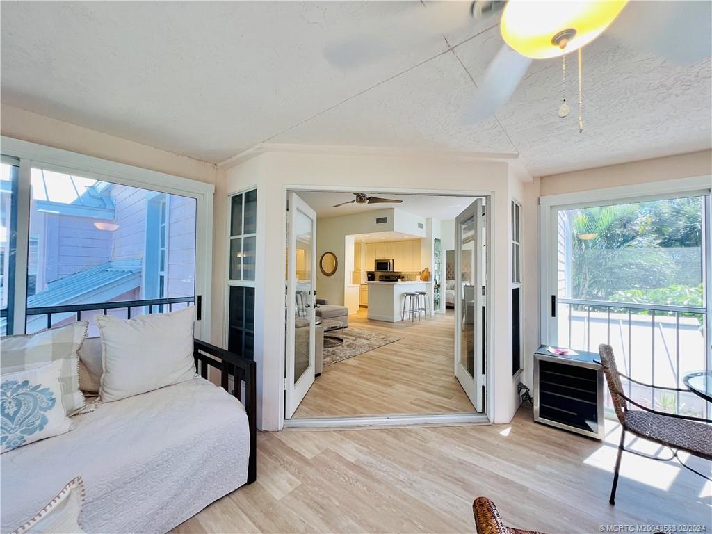 411 Northeast Plantation Road, Unit 526 Stuart, FL 34996 - Photo 35 of 76 a bedroom with furniture and a large window