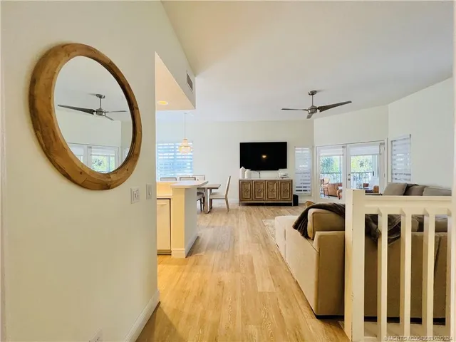a kitchen with a sink a counter top space stainless steel appliances and cabinets