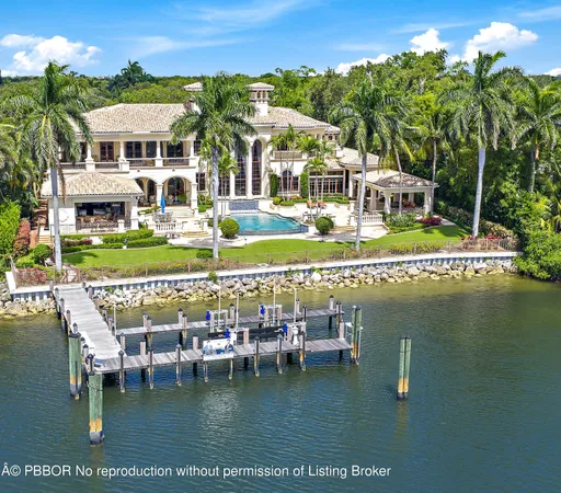 a view of a lake with a house swimming pool and outdoor space