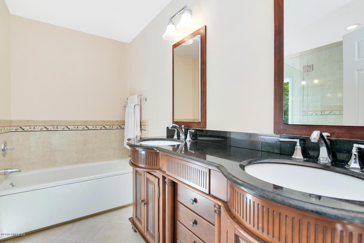 33 Ferncliff Road Cos Cob, CT 06807 - Photo 12 of 22 a bathroom with a granite countertop tub sink and mirror