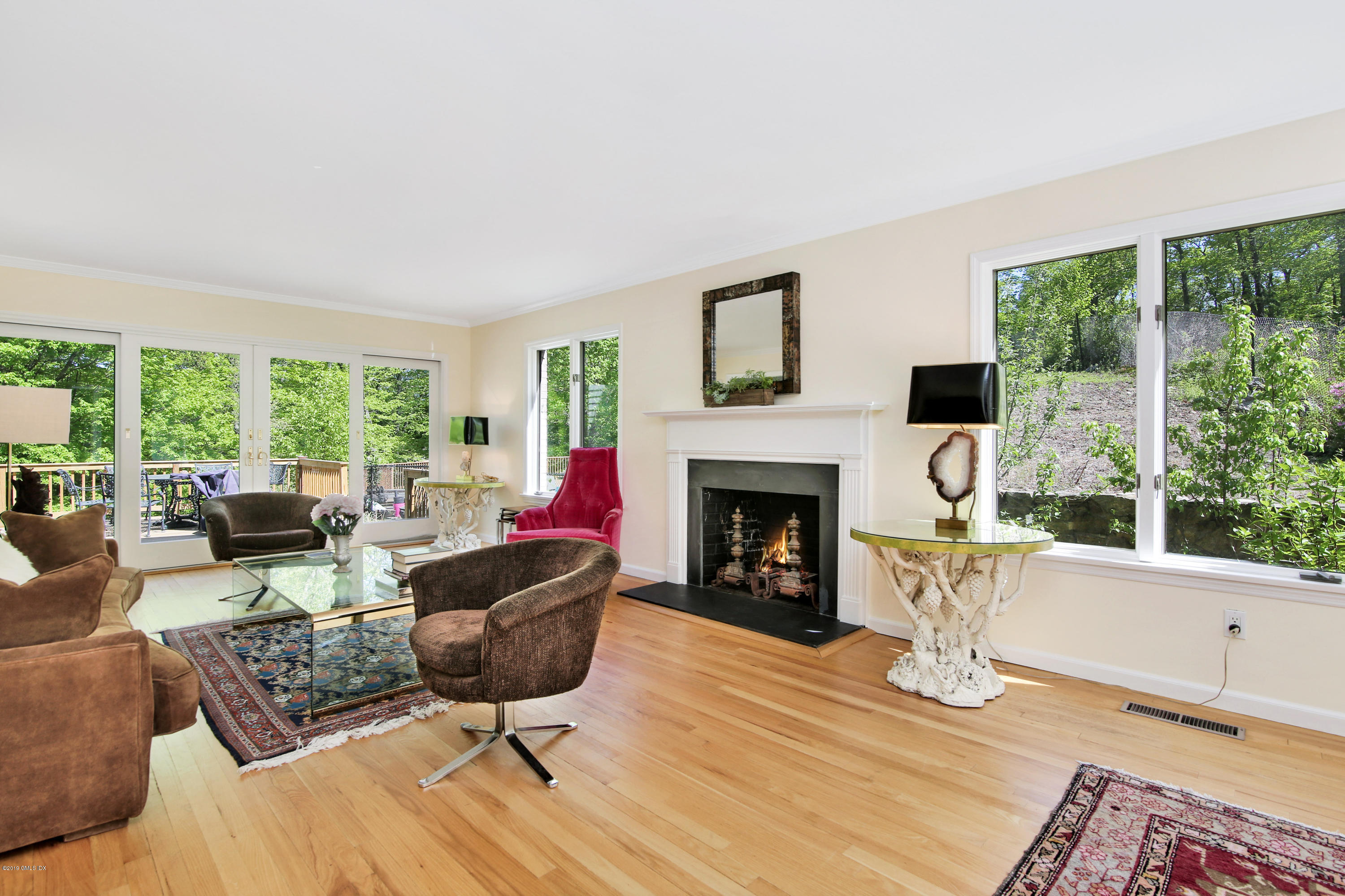 33 Ferncliff Road Cos Cob, CT 06807 - Photo 4 of 22 a living room with furniture large window and a fireplace