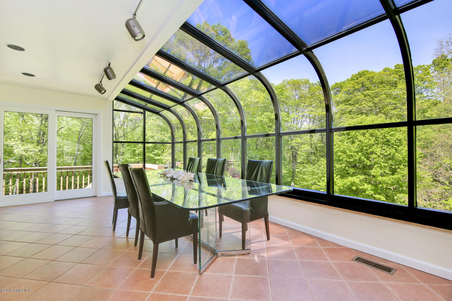 33 Ferncliff Road Cos Cob, CT 06807 - Photo 7 of 22 a view of a chairs and table in the room
