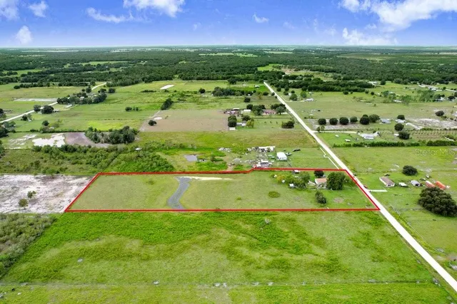 a view of yard with swimming pool and outdoor seating