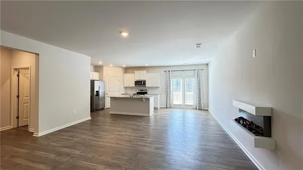 a view of a kitchen with wooden floor