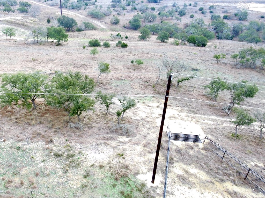 2985 Maenius Road, Unit 60 Blanco, TX 78606 - Photo 12 of 14 a view of a dirt road with a trees in the background