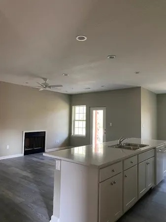 a spacious bathroom with a double vanity sink and a mirror