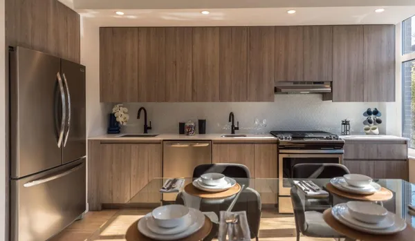 a kitchen with a sink stove and refrigerator