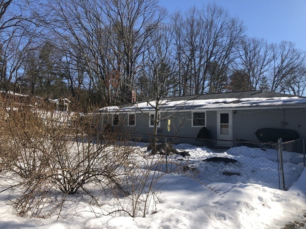 74 Old Stage Road Chelmsford, MA 01824 - Photo 31 of 33 a front view of a house with a yard