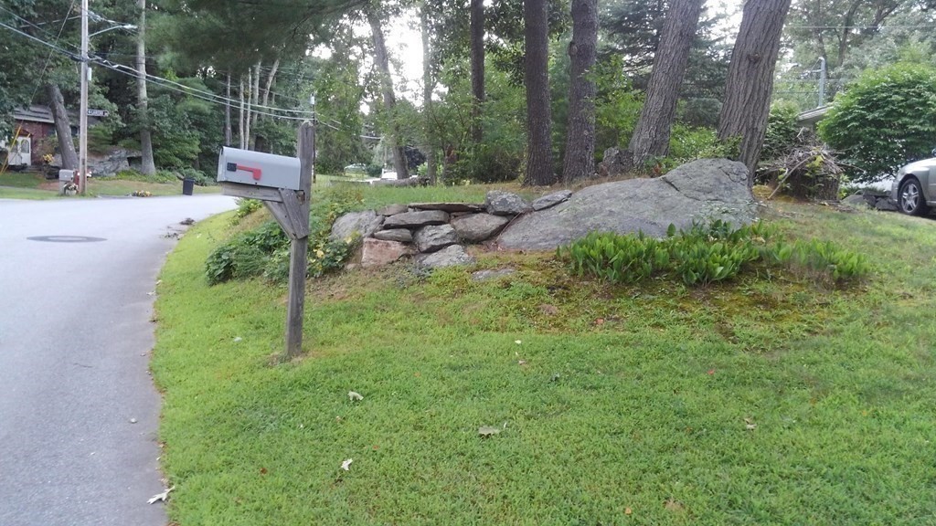 74 Old Stage Road Chelmsford, MA 01824 - Photo 33 of 33 a backyard of a house with lots of green space