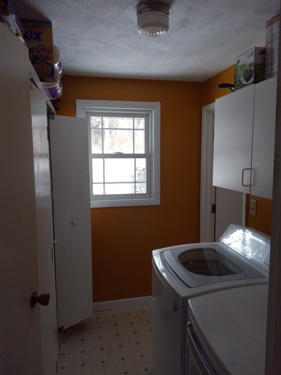 74 Old Stage Road Chelmsford, MA 01824 - Photo 9 of 33 a bathroom with a sink and washer