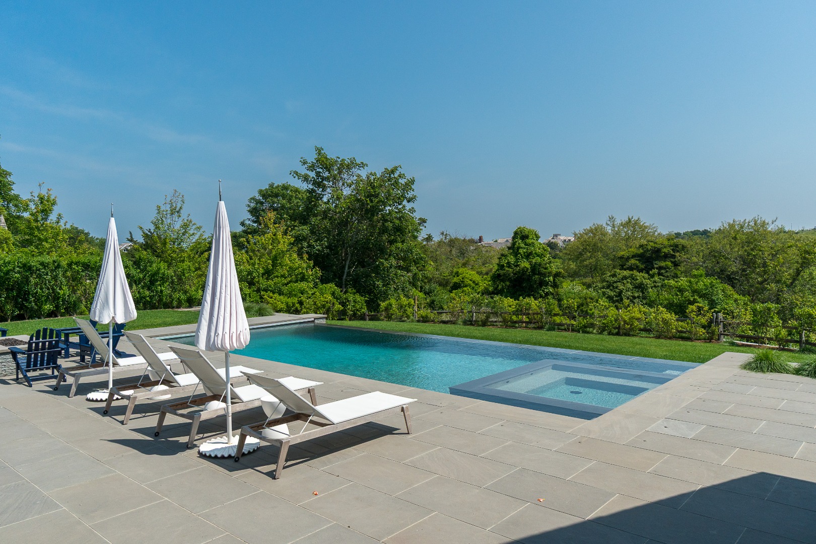 41 Monomoy Road Nantucket, MA 02554 - Photo 12 of 54 a view of a garden with lawn chairs