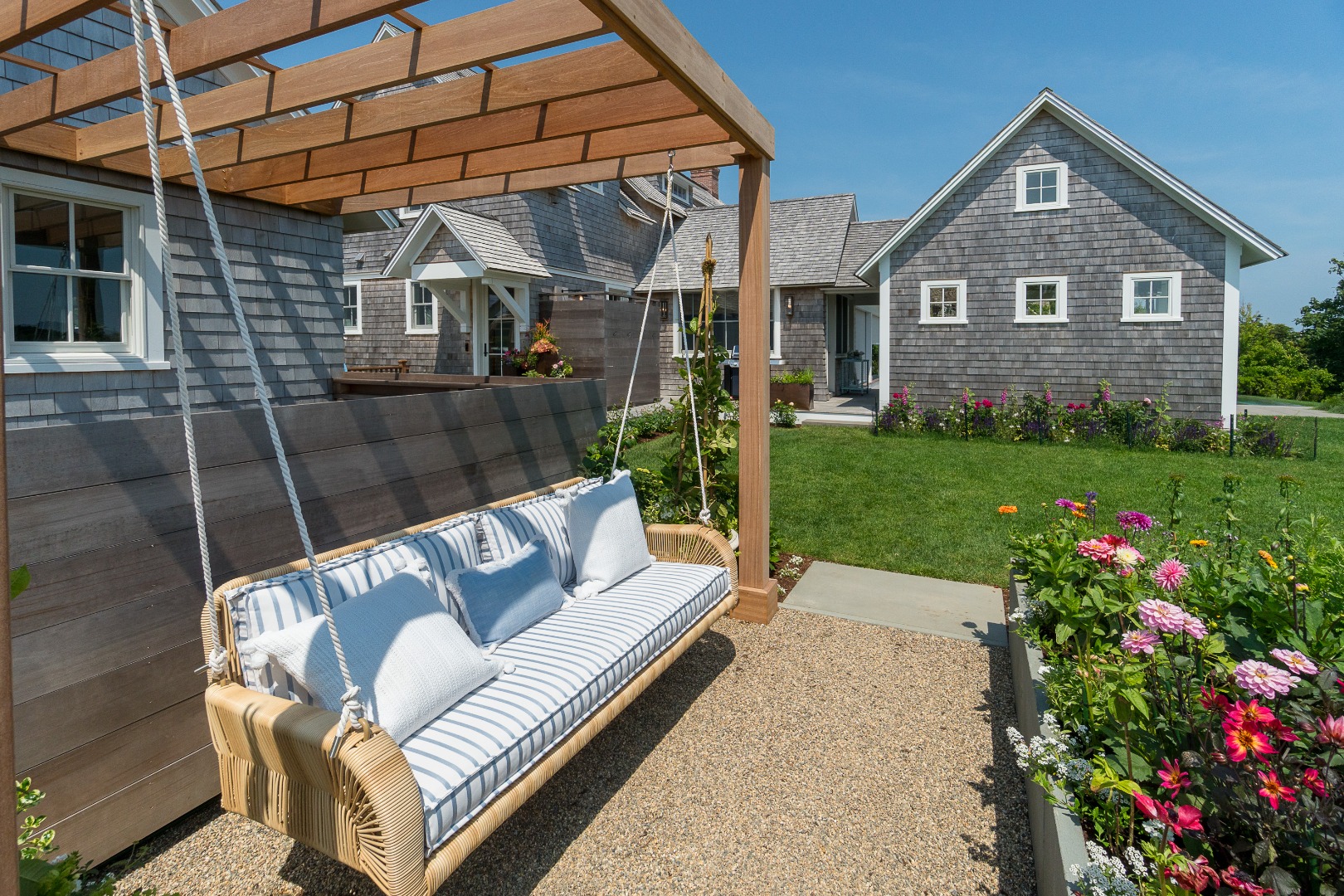 41 Monomoy Road Nantucket, MA 02554 - Photo 5 of 54 a view of a patio with couches table and chairs and potted plants