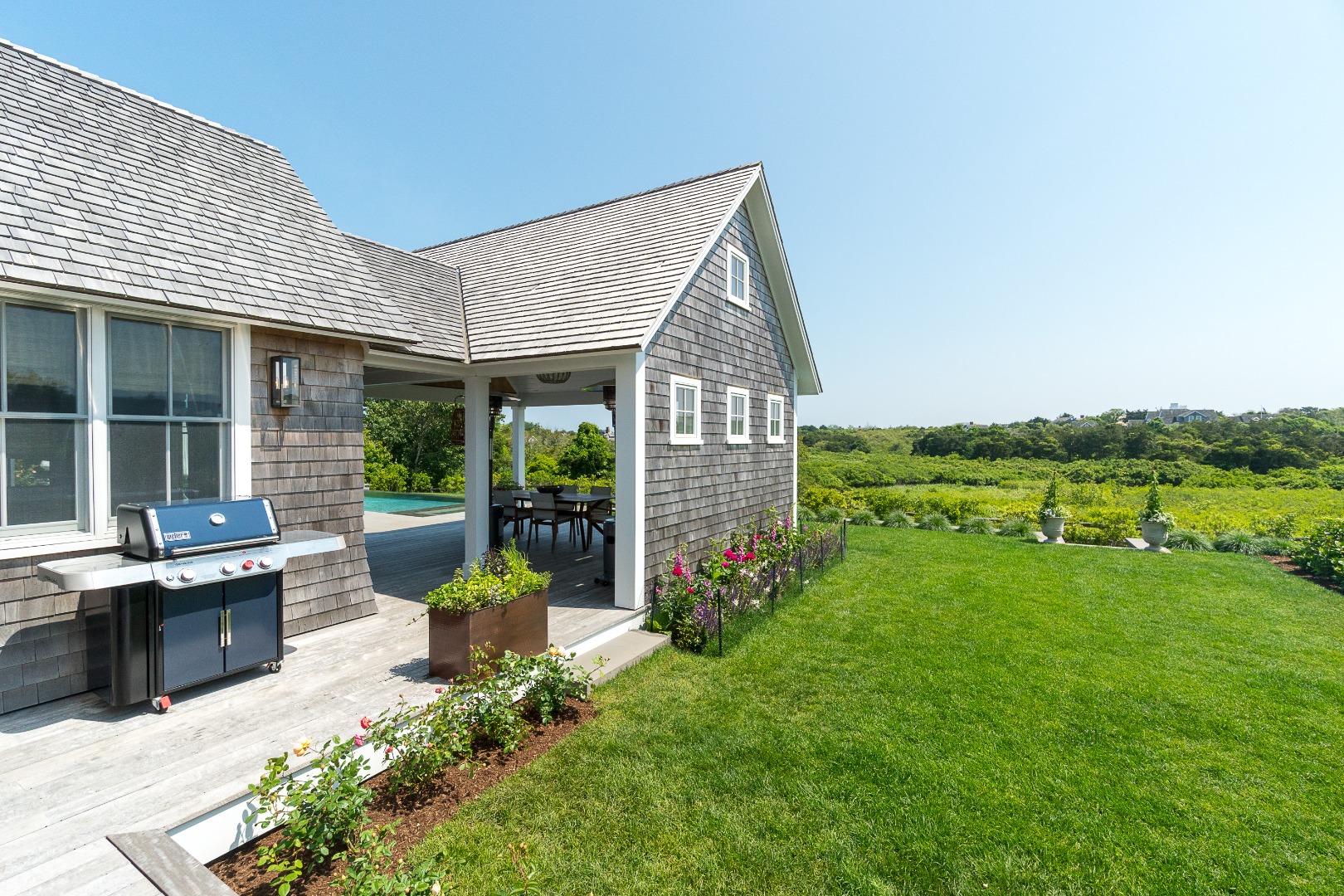 41 Monomoy Road Nantucket, MA 02554 - Photo 6 of 54 a view of a house with backyard sitting area and garden