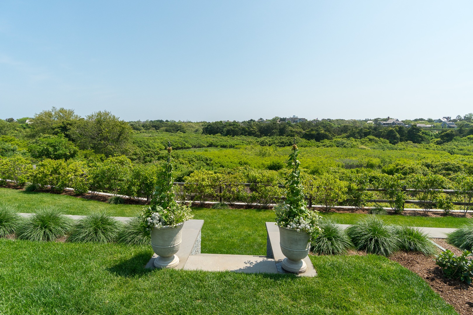41 Monomoy Road Nantucket, MA 02554 - Photo 9 of 54 a view of a garden with a lake