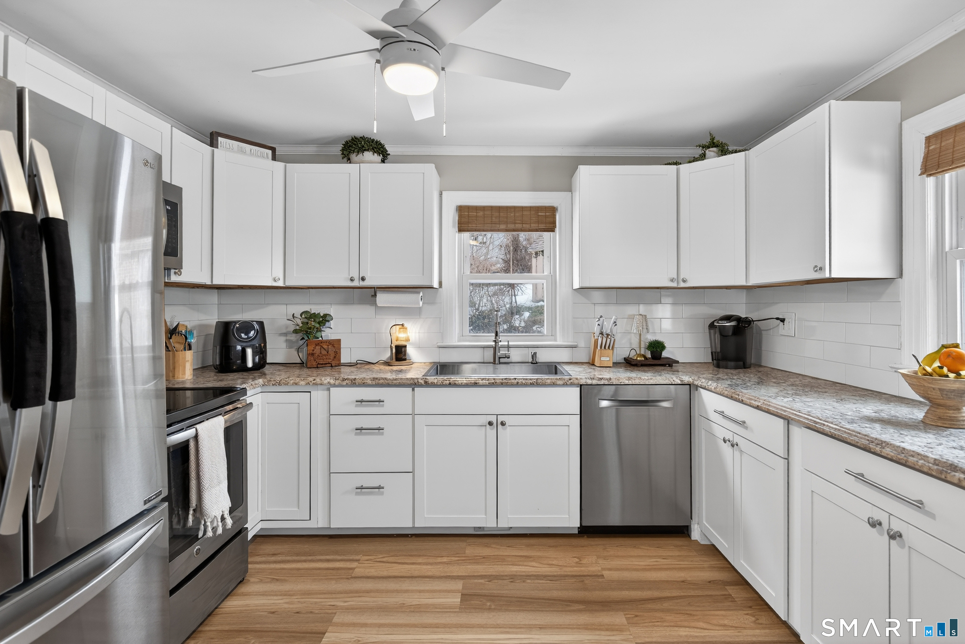 15 Evelyn Road Derby, CT 06418 - Photo 15 of 34 a kitchen with white cabinets stainless steel appliances and a window