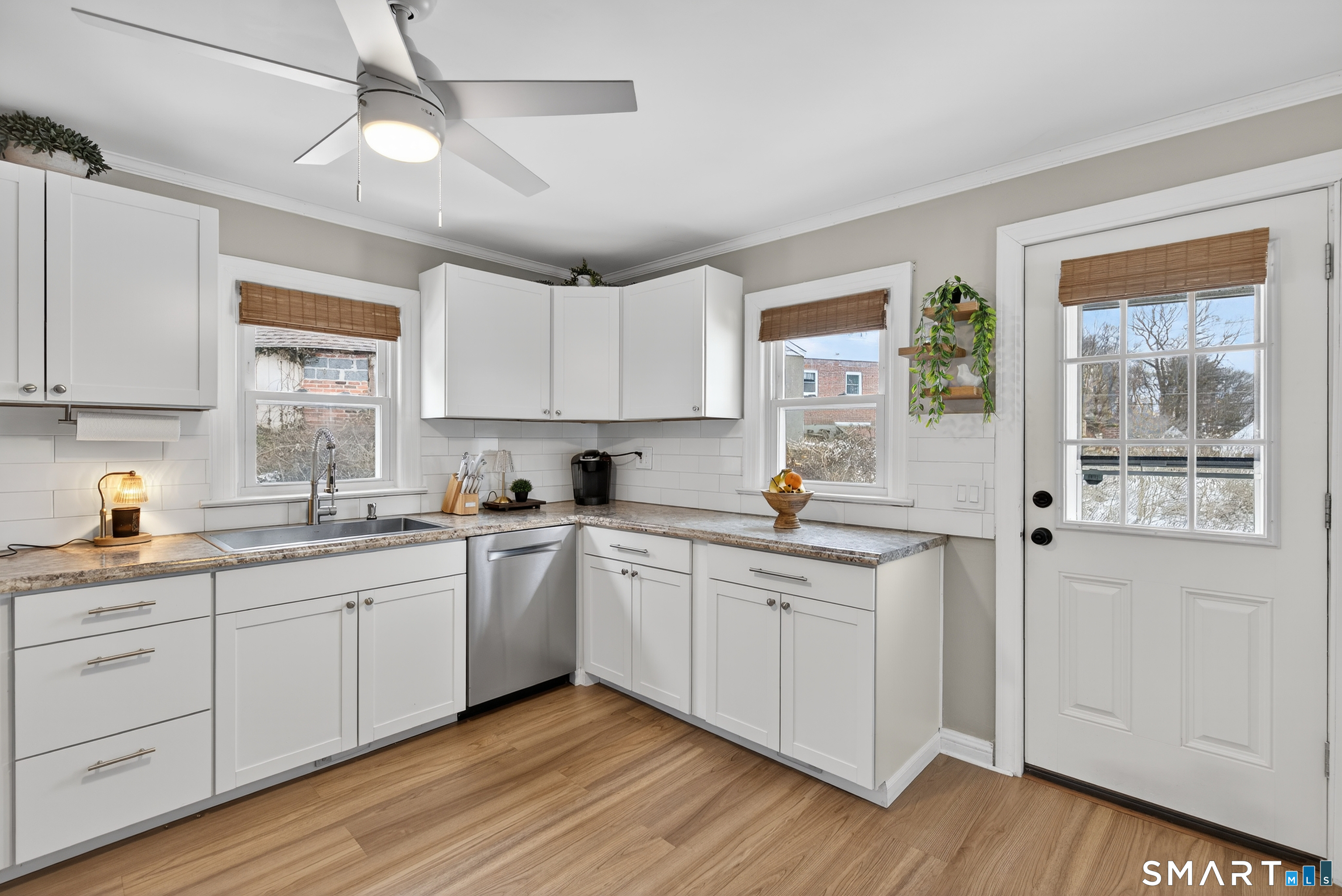 15 Evelyn Road Derby, CT 06418 - Photo 16 of 34 a kitchen with stainless steel appliances granite countertop a sink a stove cabinets and wooden floor