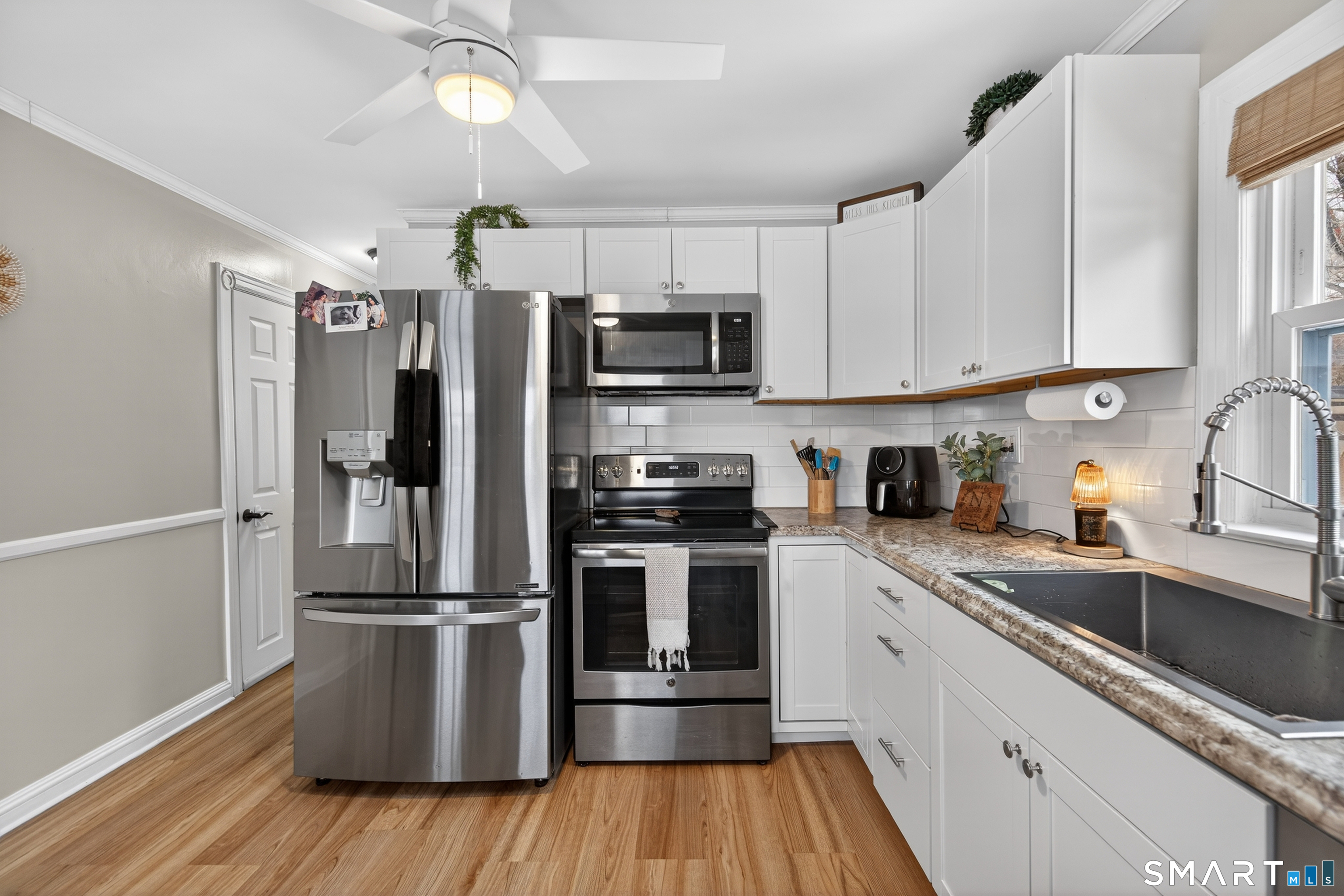 15 Evelyn Road Derby, CT 06418 - Photo 18 of 34 a kitchen with a refrigerator sink and microwave