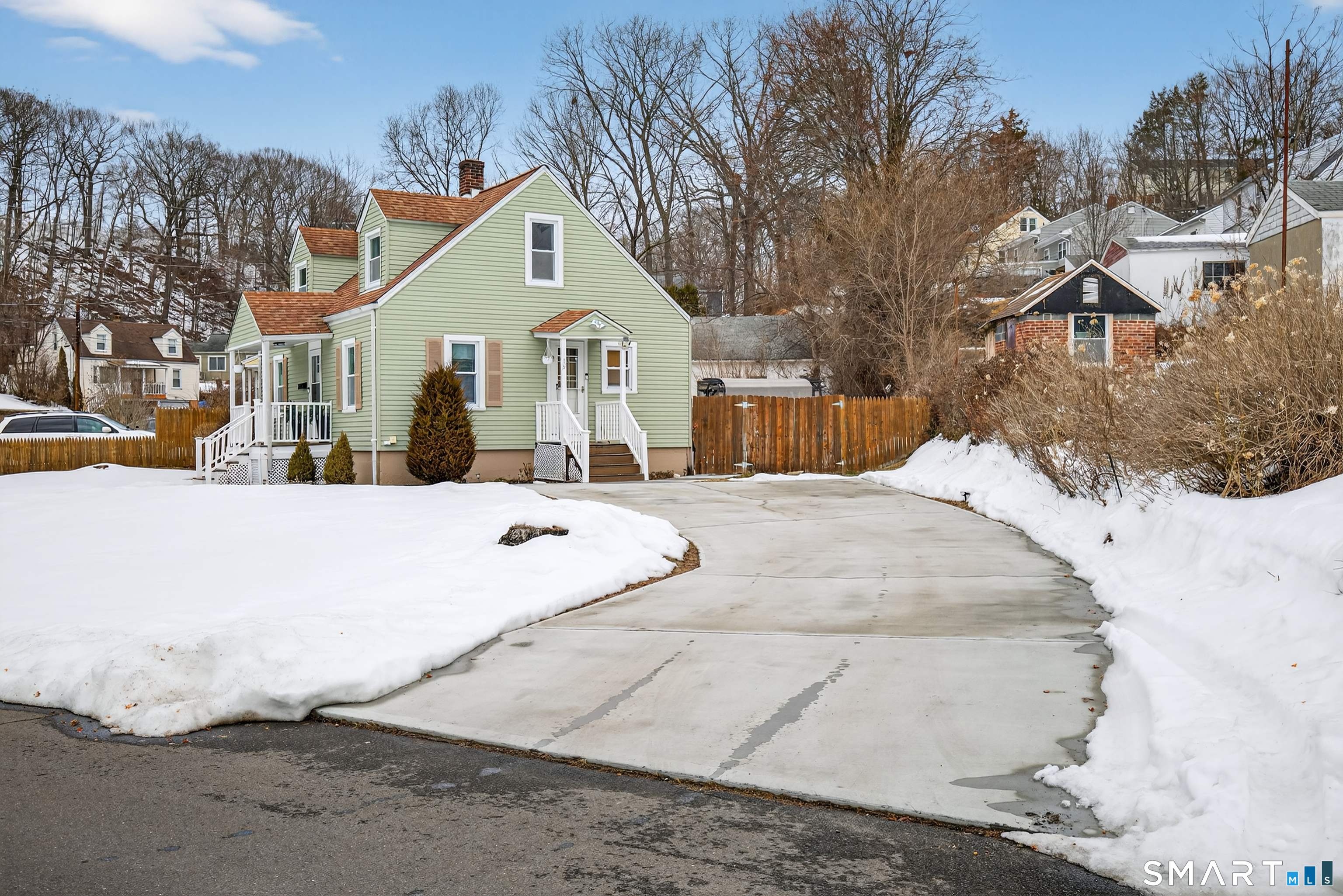 15 Evelyn Road Derby, CT 06418 - Photo 31 of 34 a view of a white house with a yard covered in snow