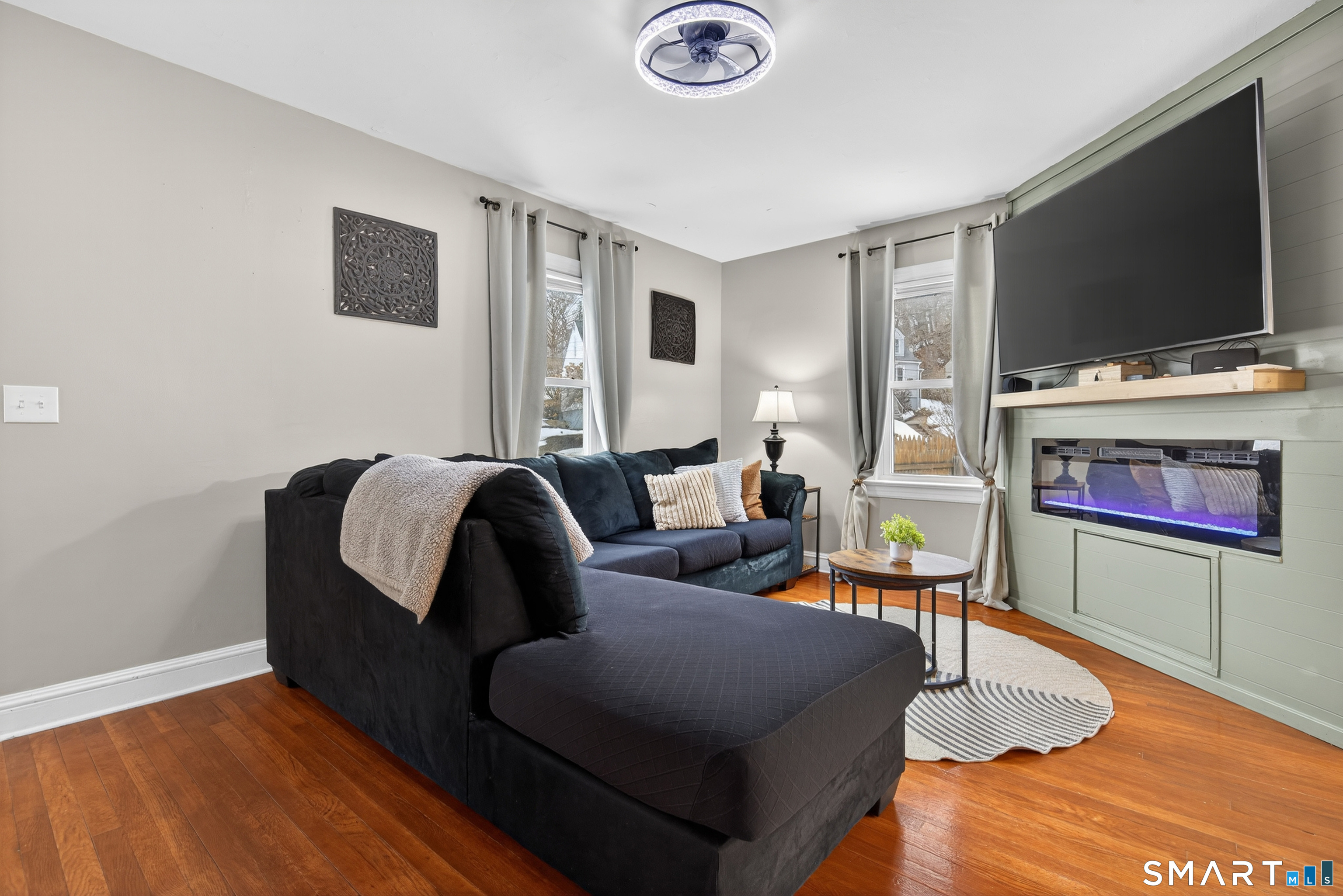 15 Evelyn Road Derby, CT 06418 - Photo 4 of 34 a living room with furniture and a flat screen tv