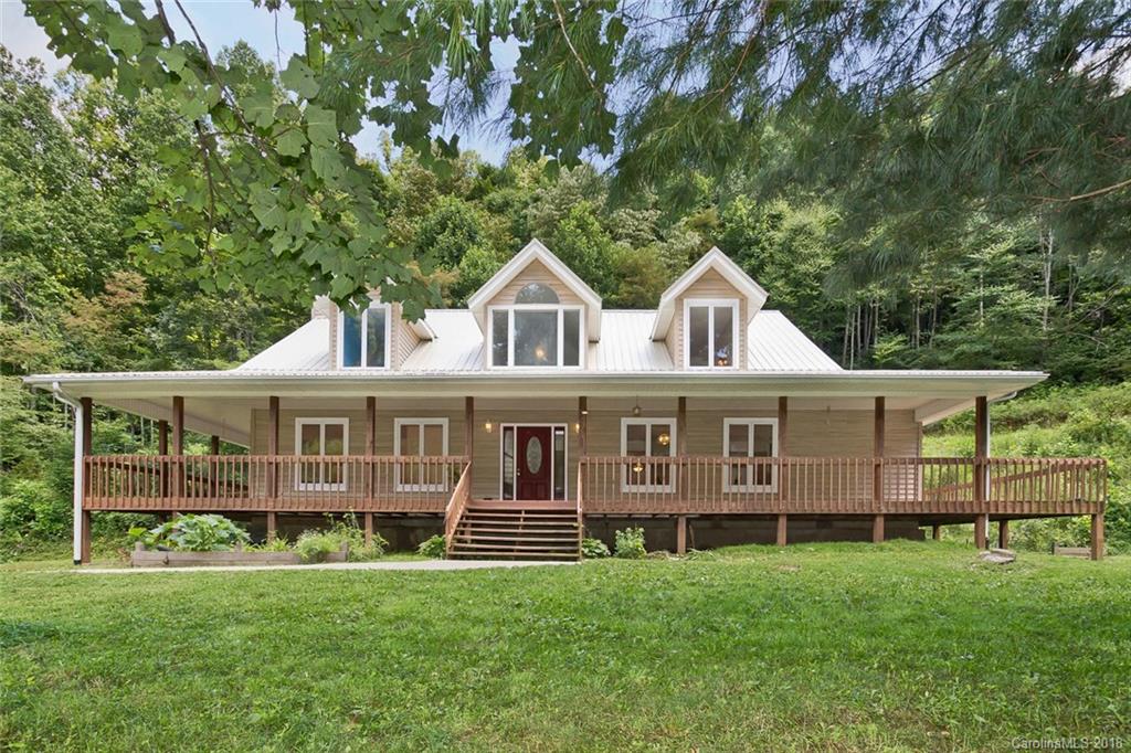 282 Fox Creek Road Mars Hill, NC 28754 - Photo 1 of 36 a front view of a house with a garden