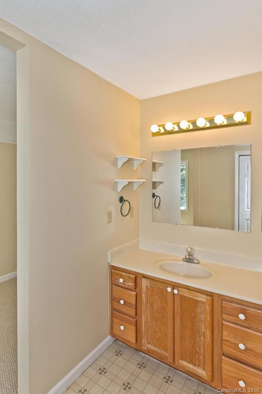 282 Fox Creek Road Mars Hill, NC 28754 - Photo 18 of 36 a bathroom with a sink and a mirror