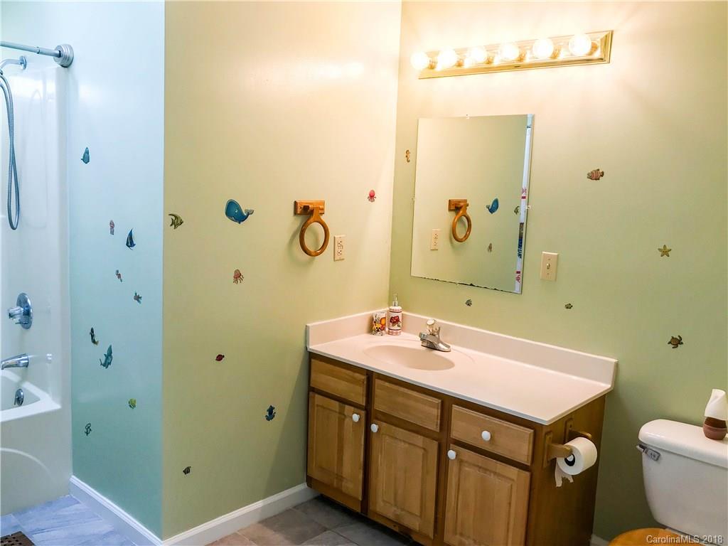 282 Fox Creek Road Mars Hill, NC 28754 - Photo 22 of 36 a bathroom with a sink and a mirror