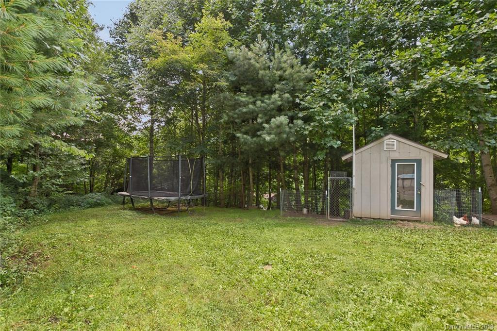 282 Fox Creek Road Mars Hill, NC 28754 - Photo 32 of 36 a view of a house with a yard