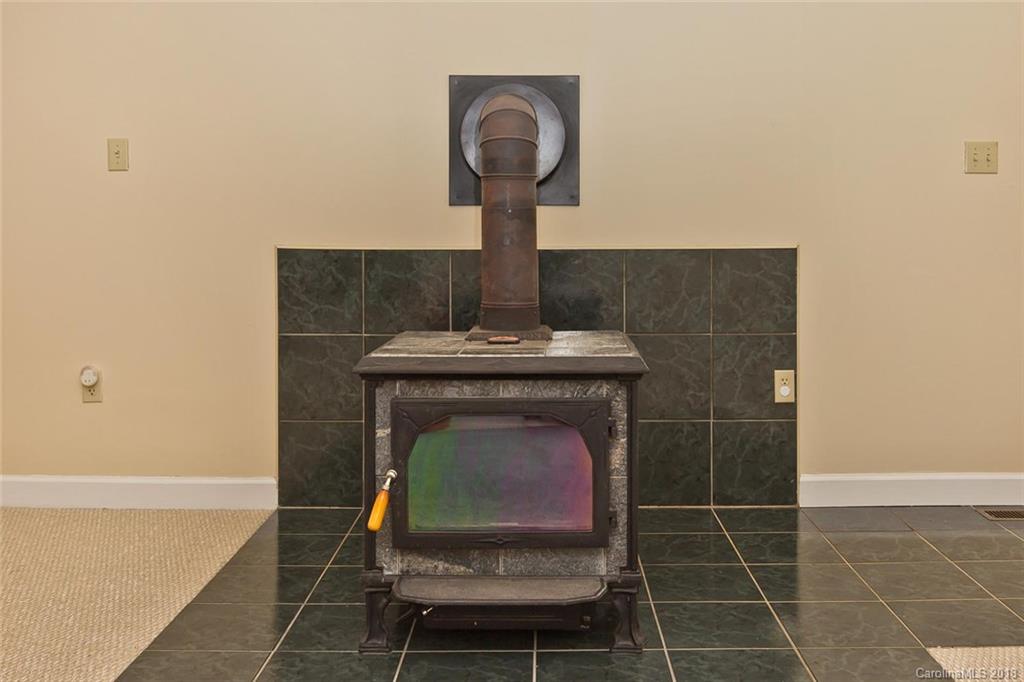 282 Fox Creek Road Mars Hill, NC 28754 - Photo 8 of 36 a room with a sink and a mirror