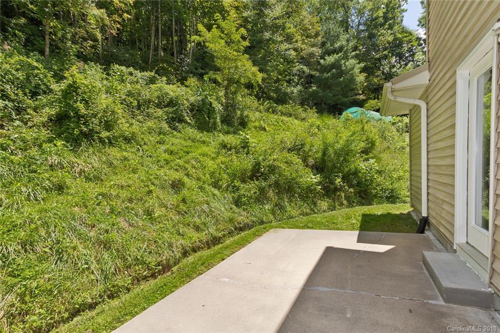 282 Fox Creek Road Mars Hill, NC 28754 - Photo 9 of 36 a view of a garden with pathway