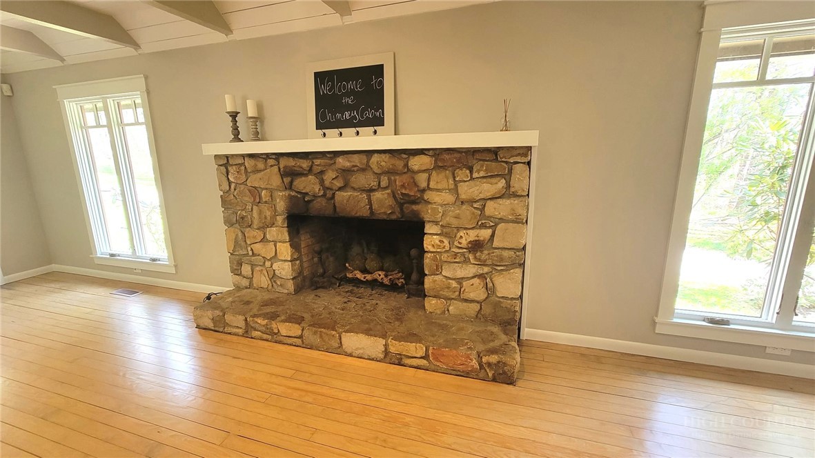 172 Yarrow Lane Boone, NC 28607 - Photo 5 of 30 a living room with wooden floor and a fireplace