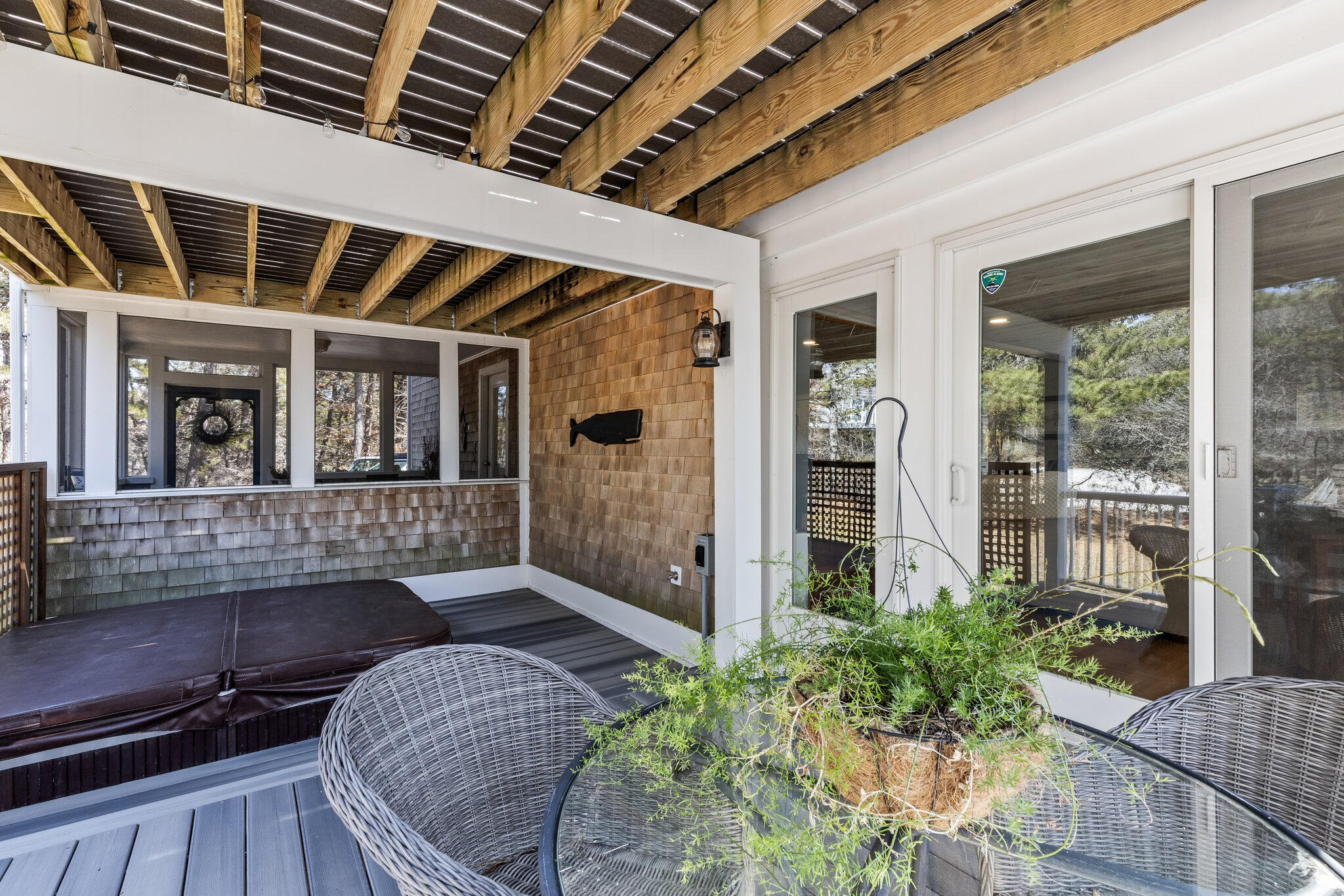 6 Short Lots Lane Truro, MA 02666 - Photo 11 of 63 a view of a porch with chairs and potted plants