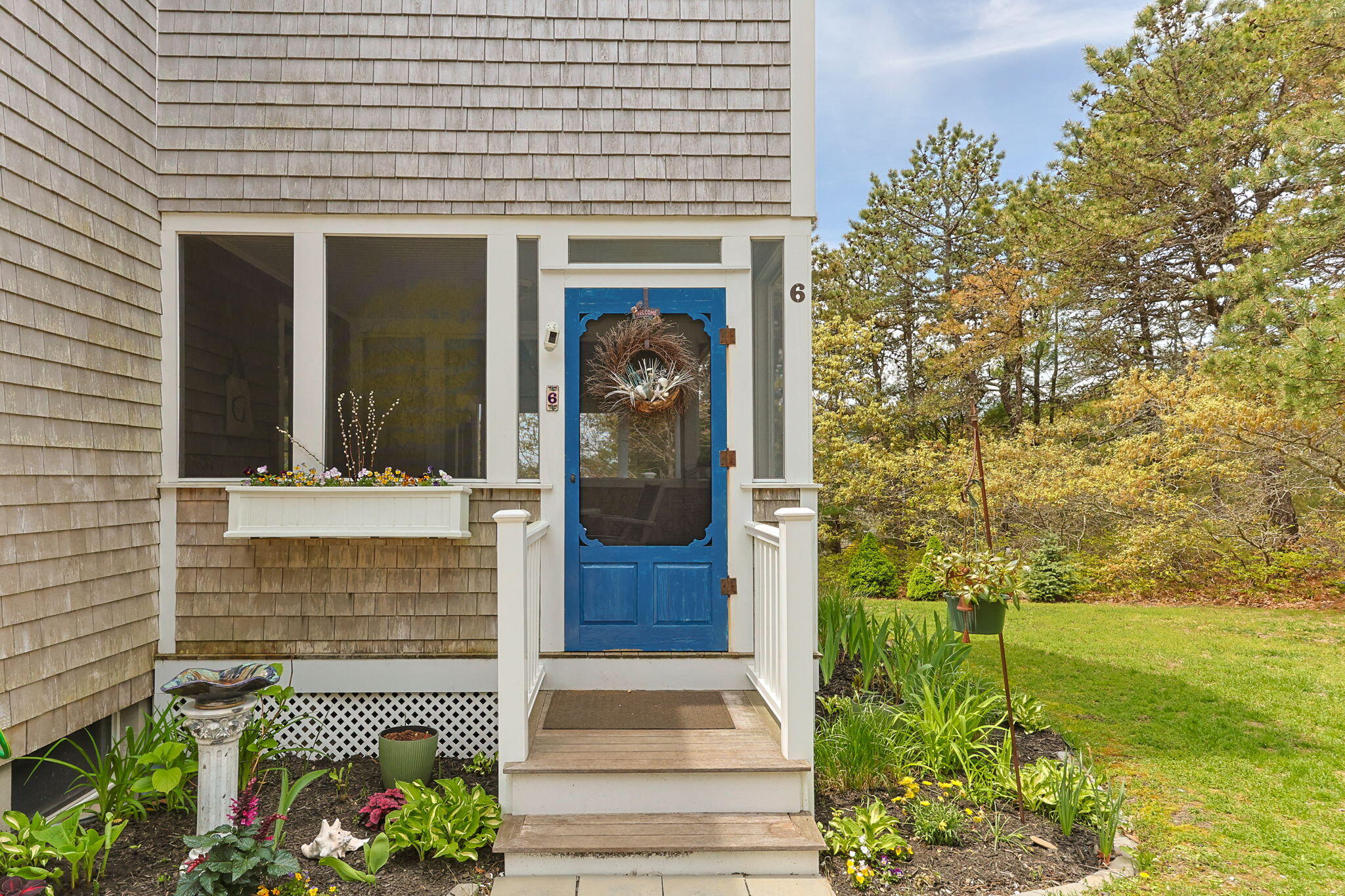 6 Short Lots Lane Truro, MA 02666 - Photo 2 of 63 a view of front door of house and yard with green space
