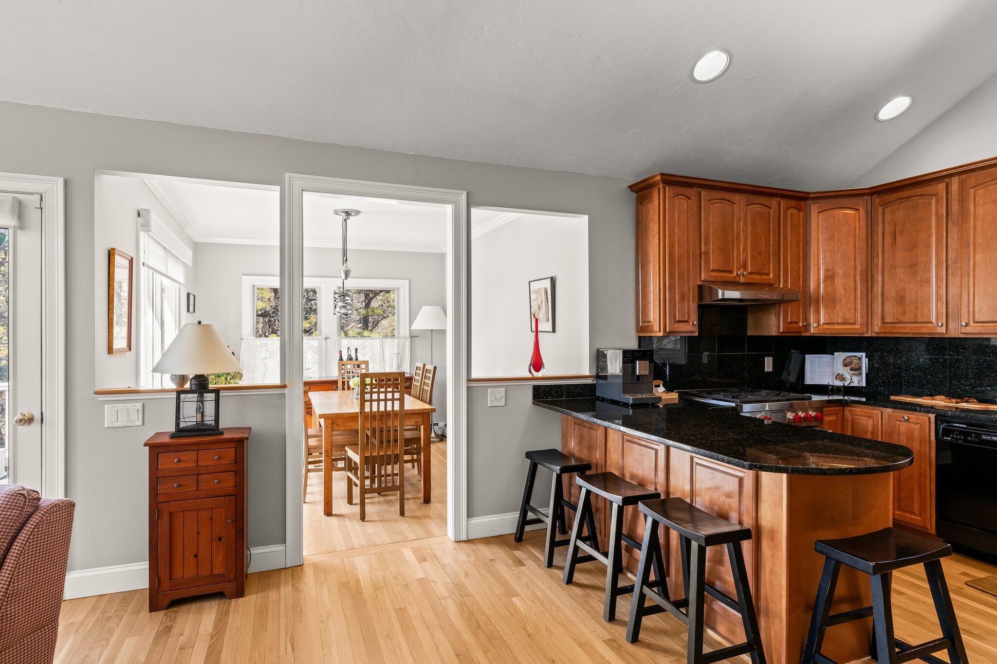 6 Short Lots Lane Truro, MA 02666 - Photo 23 of 63 a kitchen with stainless steel appliances granite countertop sink stove top oven and cabinets