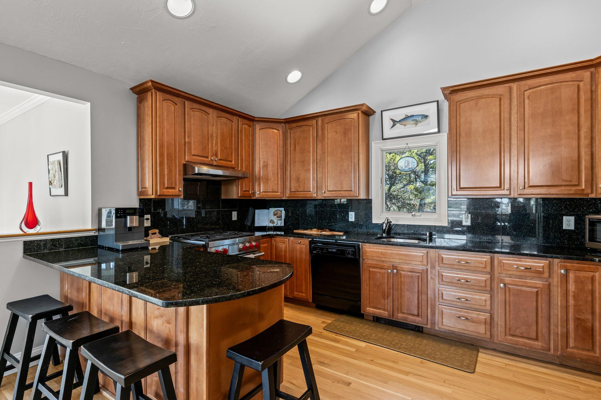 6 Short Lots Lane Truro, MA 02666 - Photo 26 of 63 a kitchen with granite countertop a sink cabinets and window