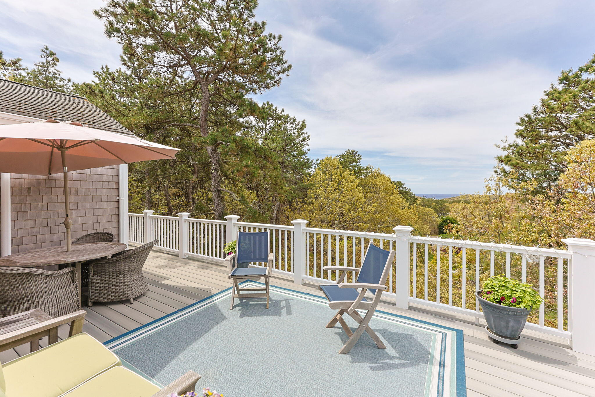 6 Short Lots Lane Truro, MA 02666 - Photo 35 of 63 a view of a chair and tables on the roof deck