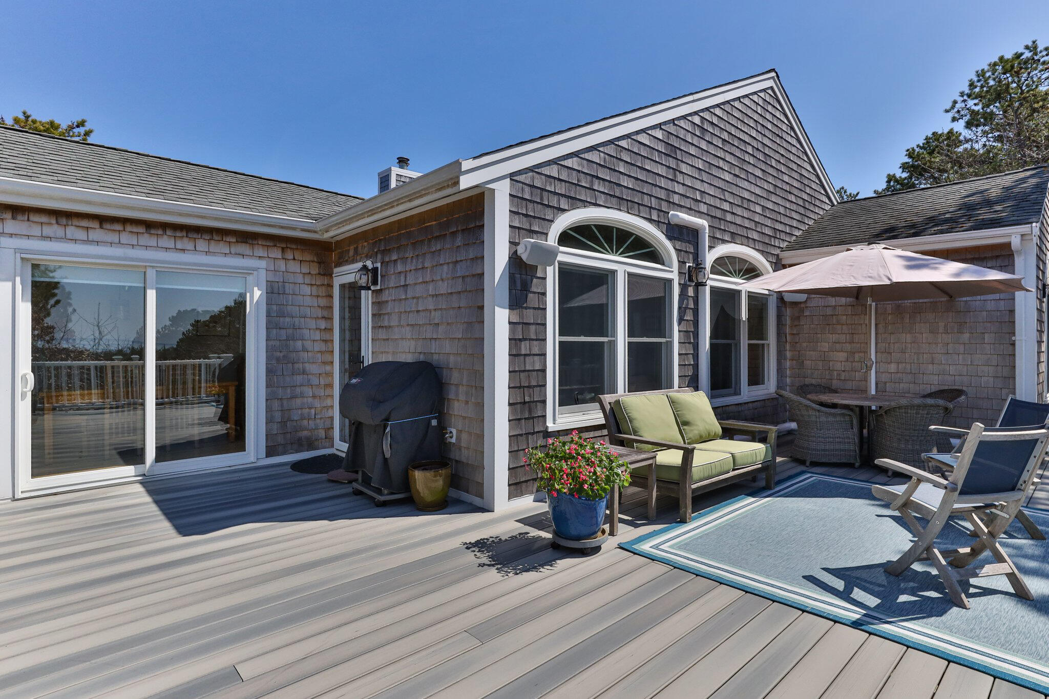 6 Short Lots Lane Truro, MA 02666 - Photo 38 of 63 a view of a patio with table and chairs and wooden floor