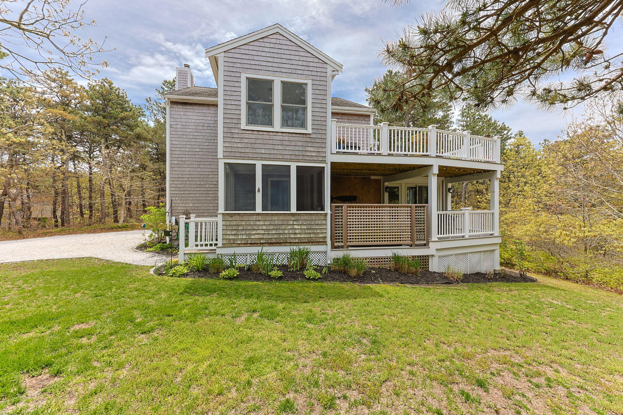 6 Short Lots Lane Truro, MA 02666 - Photo 43 of 63 a front view of a house with a yard