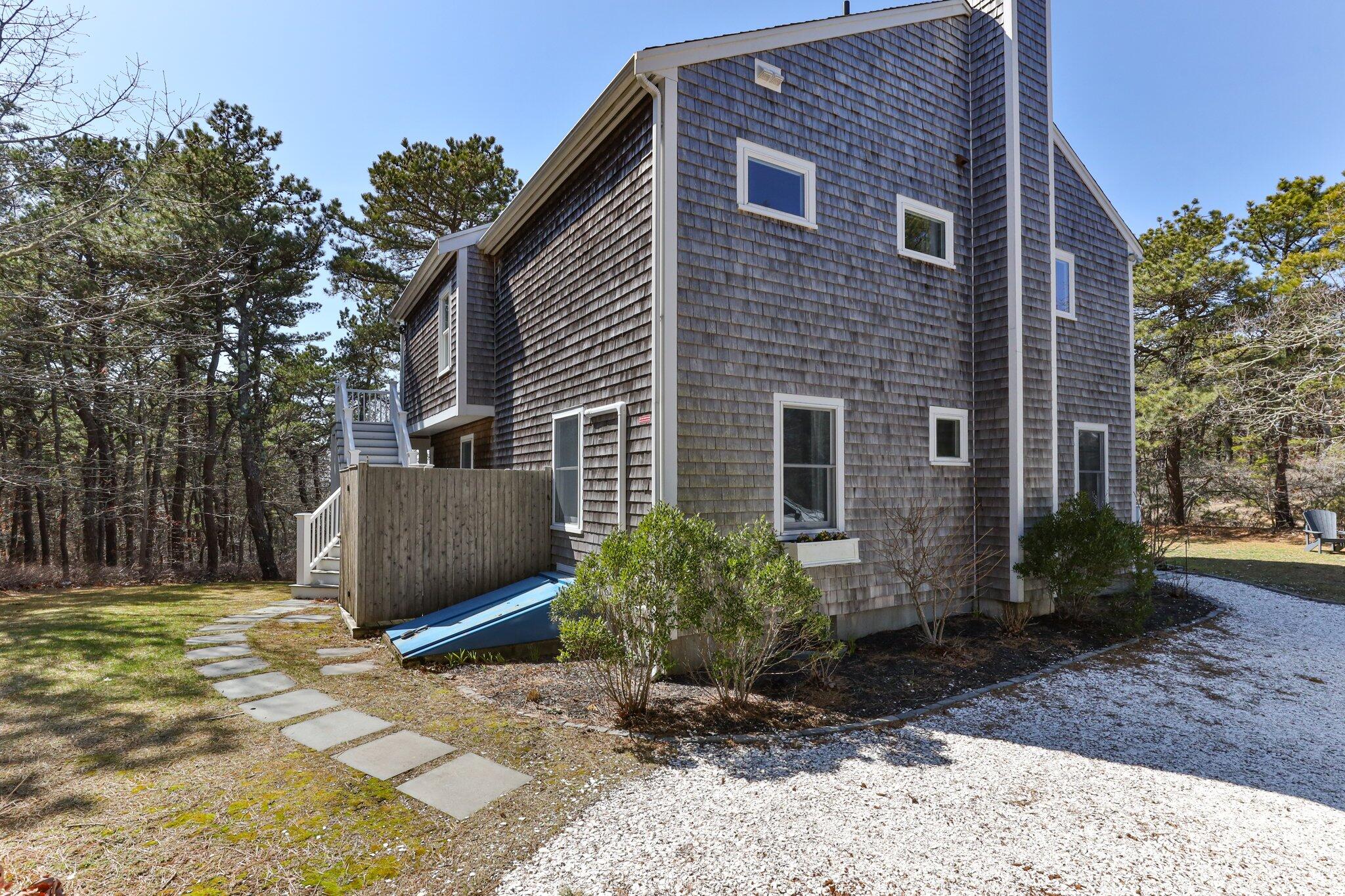 6 Short Lots Lane Truro, MA 02666 - Photo 48 of 63 a view of a house with backyard and garden