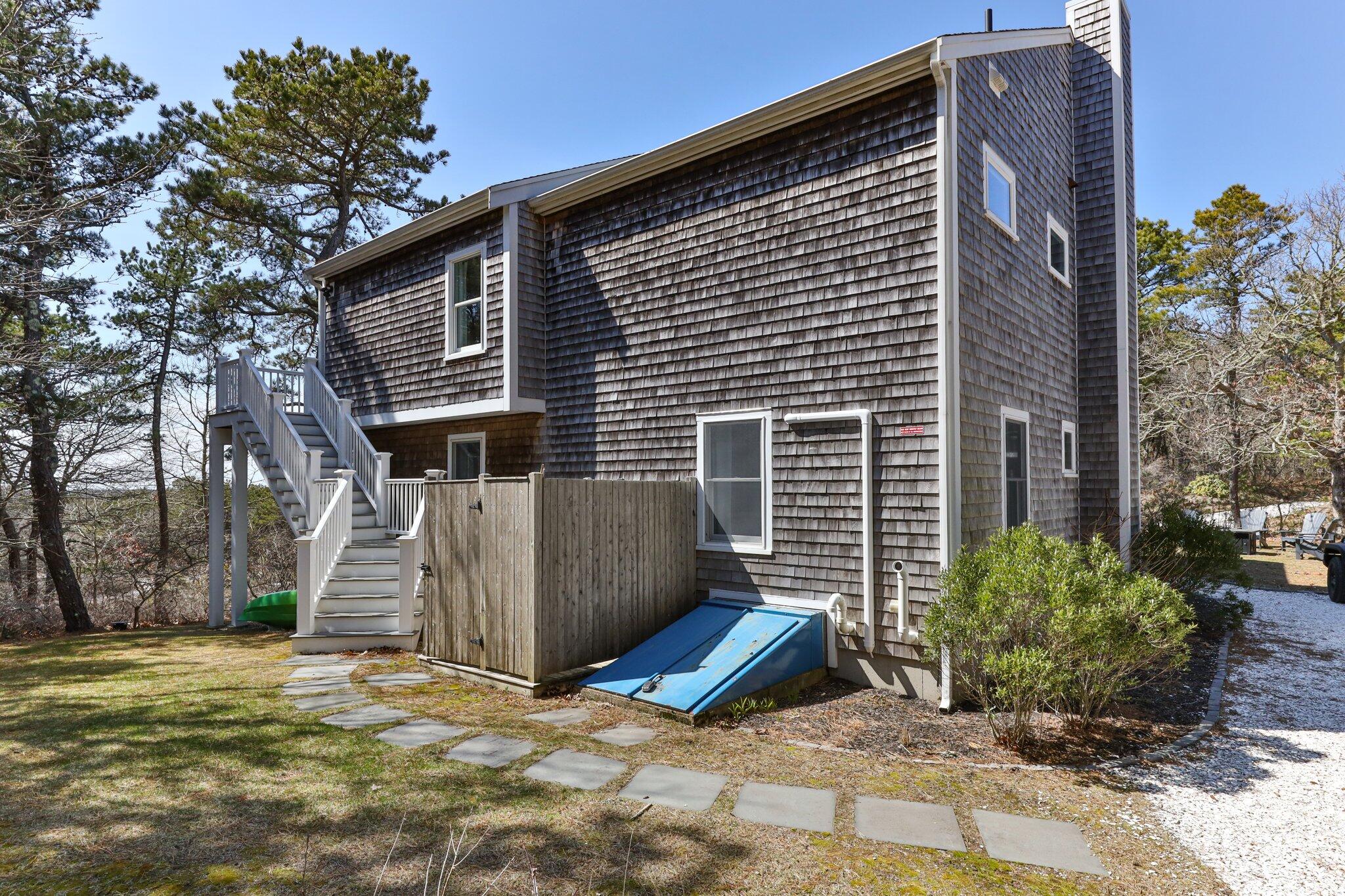 6 Short Lots Lane Truro, MA 02666 - Photo 49 of 63 a view of a house with a yard