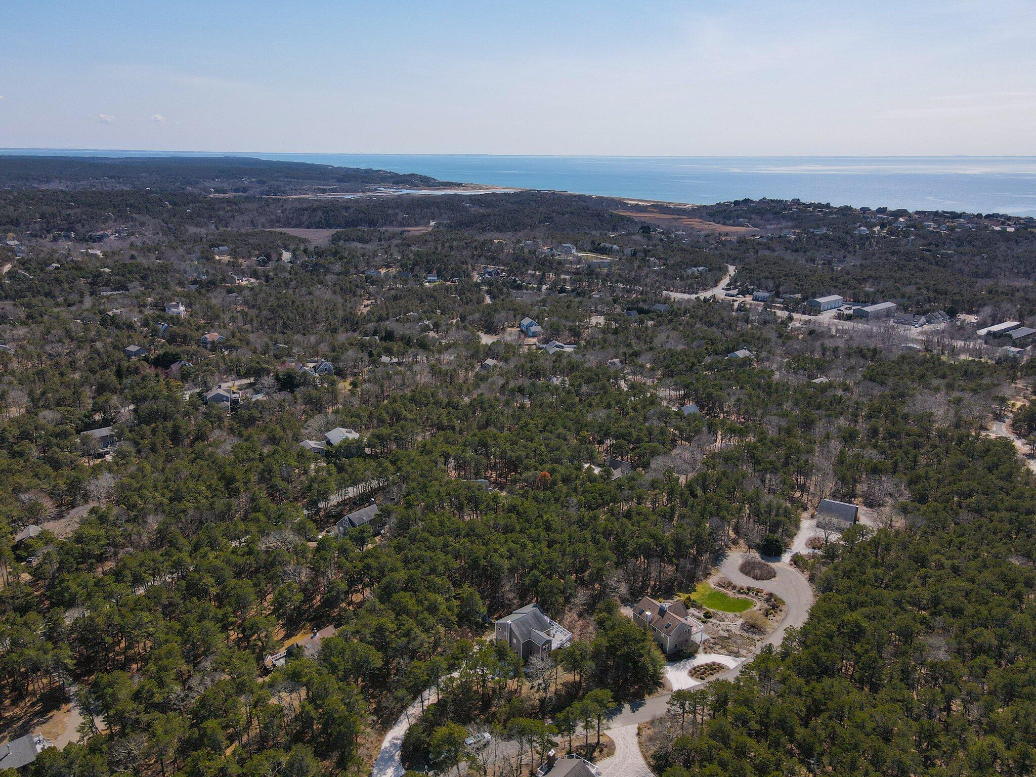 6 Short Lots Lane Truro, MA 02666 - Photo 57 of 63 an aerial view of residential houses with outdoor space and trees