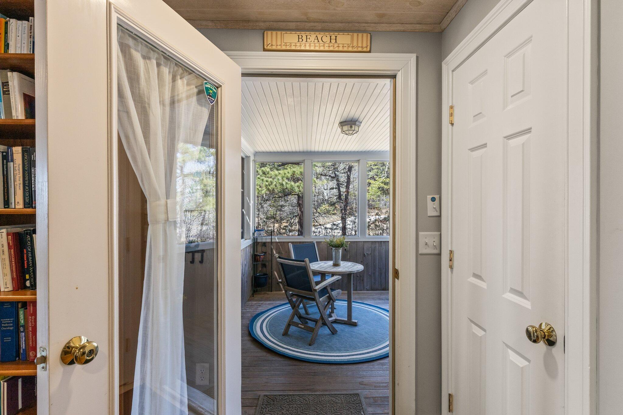 6 Short Lots Lane Truro, MA 02666 - Photo 6 of 63 a view of a hallway with living room and dining room view